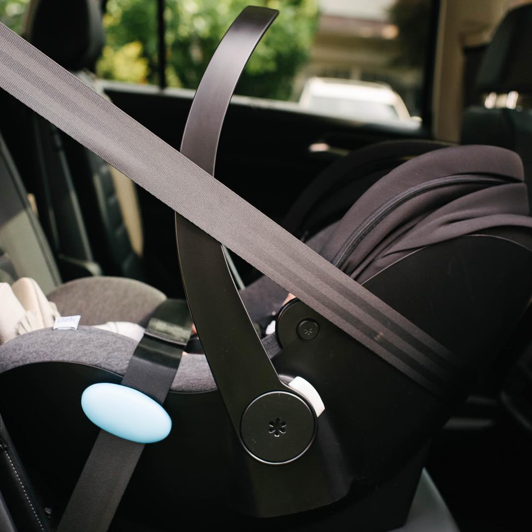 side view of a baby in the Clek Liing car seat, shop Kidsland