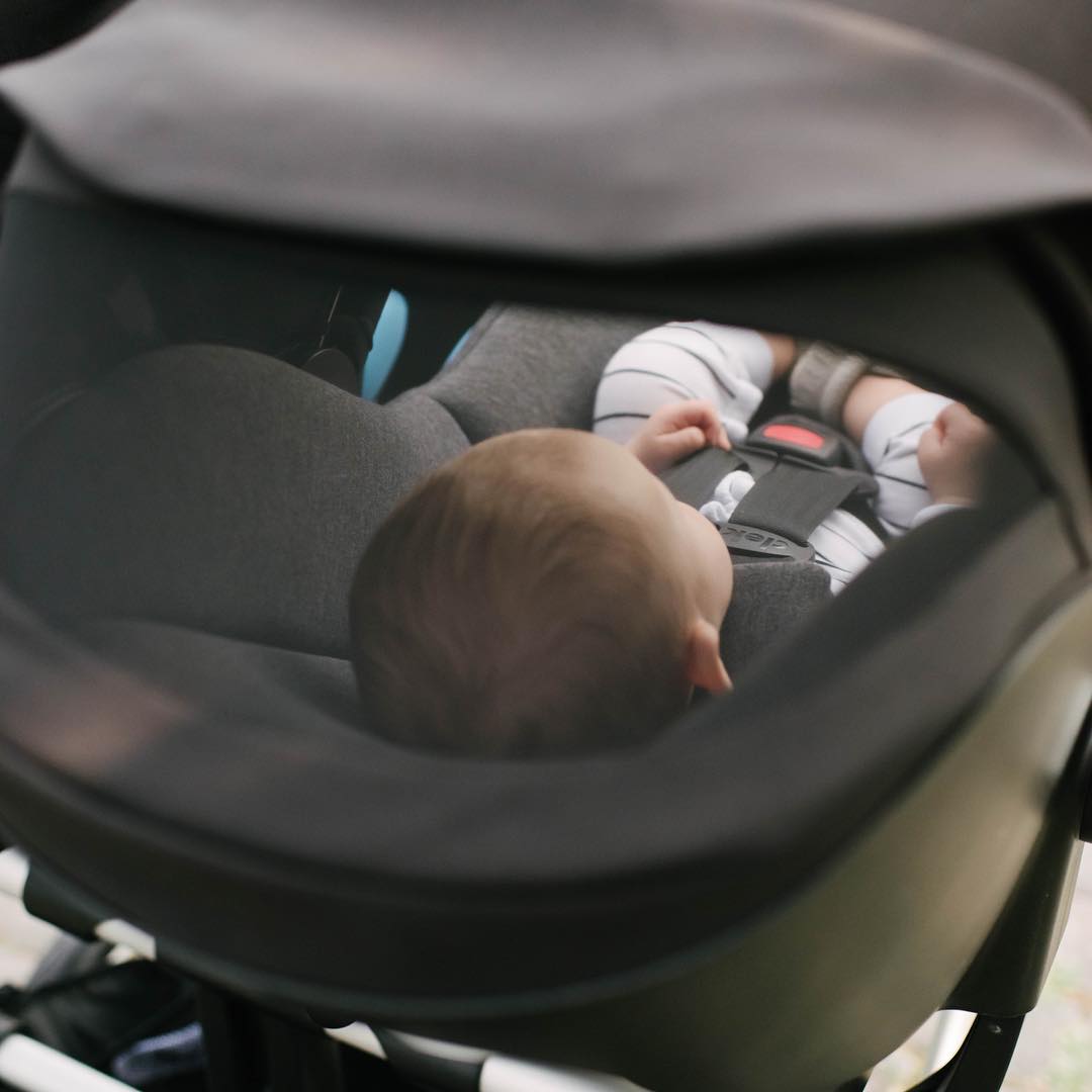 top view of a baby in the Clek Liing car seat, shop Kidsland